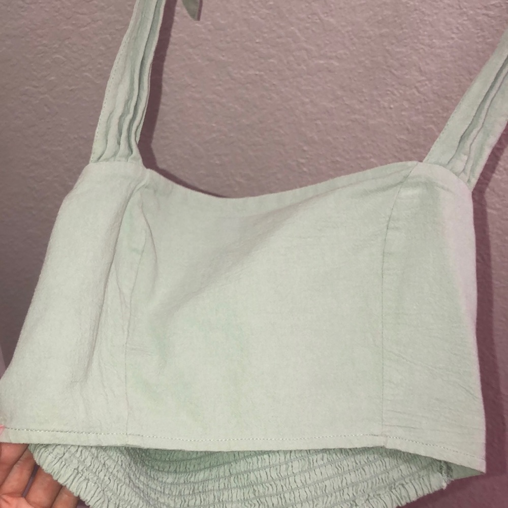 A cute green crop with a tie for straps